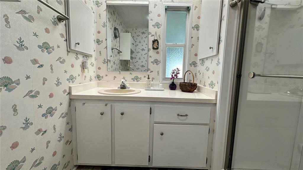 5619 Bayshore Road, Unit 163 Palmetto, FL 34221 - Photo 29 of 44 a bathroom with a sink and a mirror