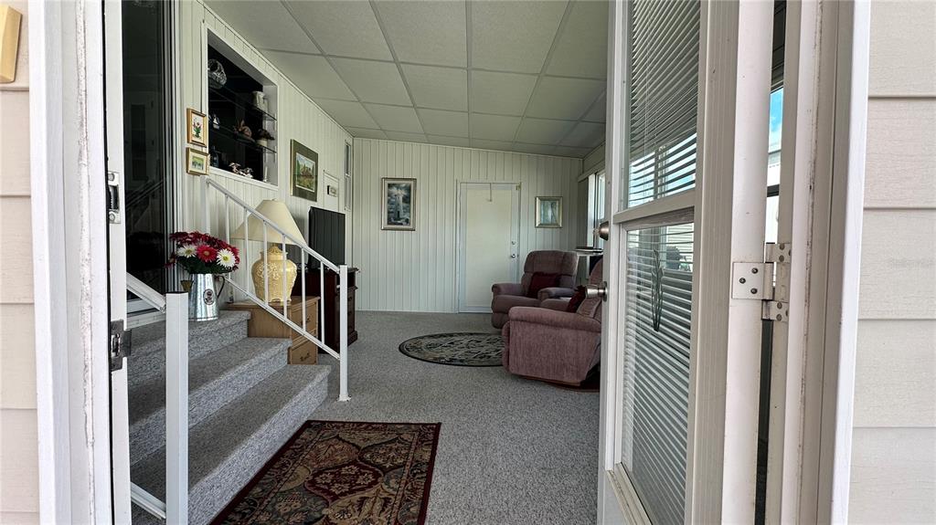 5619 Bayshore Road, Unit 163 Palmetto, FL 34221 - Photo 31 of 44 a hallway with a couch and a stove top oven