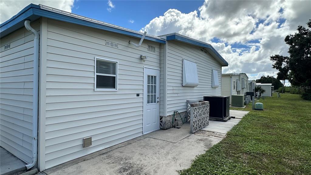 5619 Bayshore Road, Unit 163 Palmetto, FL 34221 - Photo 37 of 44 a view of a house with a yard