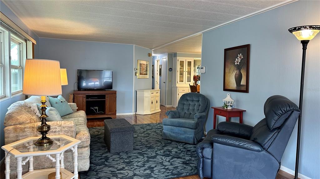 5619 Bayshore Road, Unit 163 Palmetto, FL 34221 - Photo 7 of 44 a living room with furniture fireplace and a window
