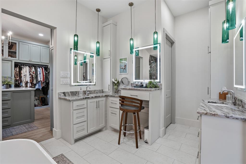 11754 North Court Azle, TX 76020 - Photo 14 of 38 a bathroom with a granite countertop sink a mirror and a bathtub