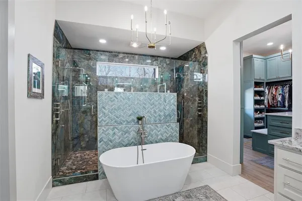 a bathroom with a bathtub and shower