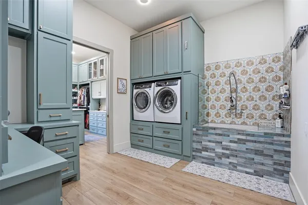 a view of a storage and utility room with cabinets