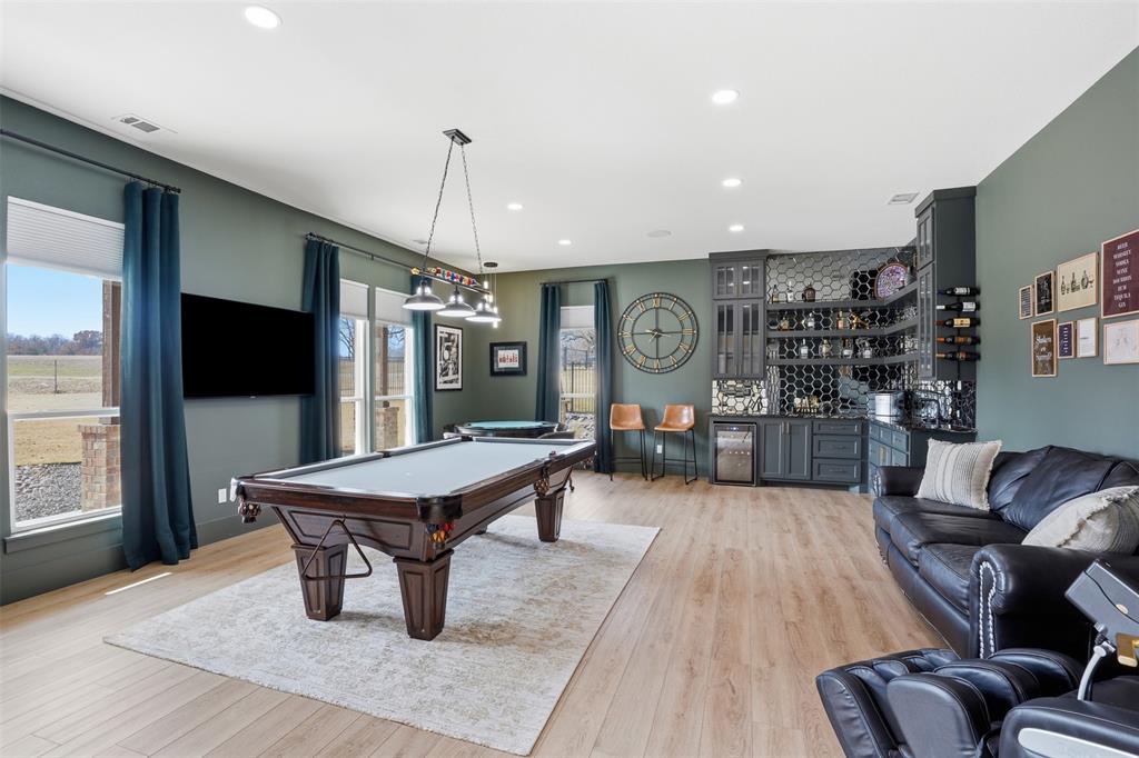 11754 North Court Azle, TX 76020 - Photo 21 of 38 a living room with furniture a flat screen tv and kitchen view