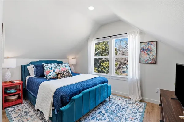a bedroom with a bed and a table