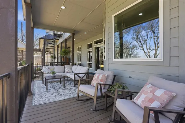 a patio with table and chairs