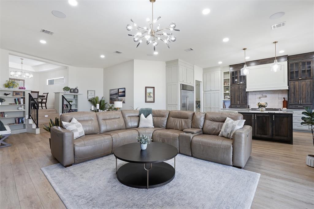 11754 North Court Azle, TX 76020 - Photo 6 of 38 a living room with furniture kitchen and a chandelier