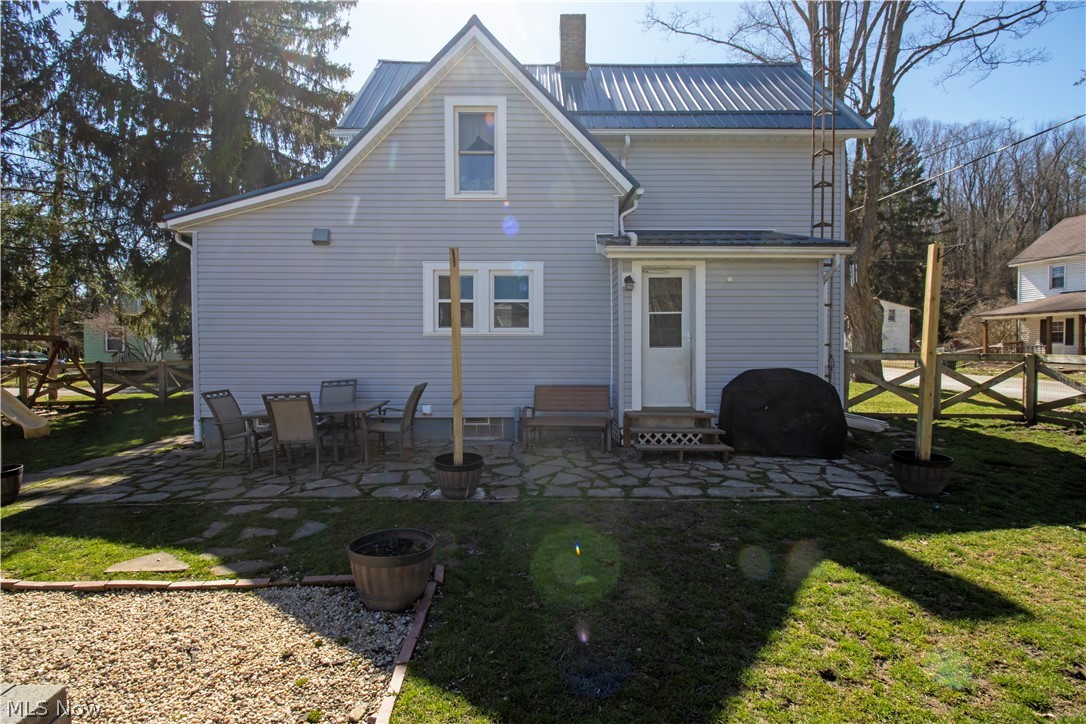5299 Overton Road Wooster, OH 44691 - Photo 7 of 26 Back of property featuring a patio and a lawn