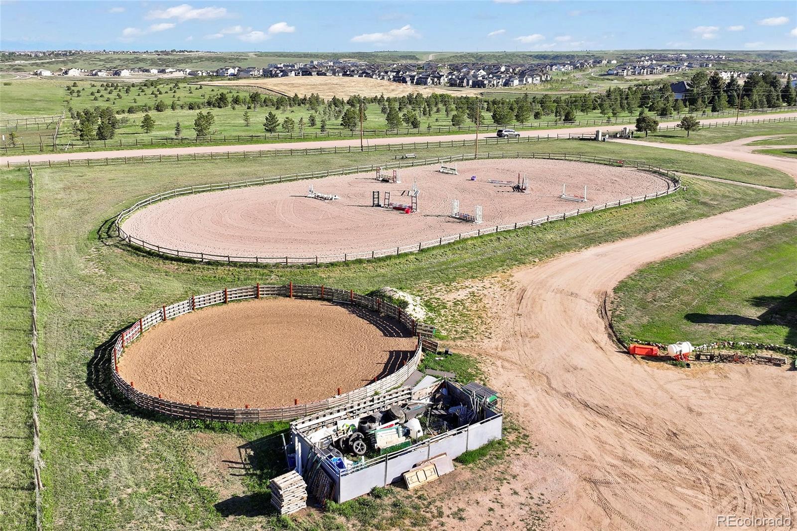 1705 Outter Marker Road Castle Rock, CO 80108 - Photo 8 of 40 an aerial view of a house a yard and outdoor seating