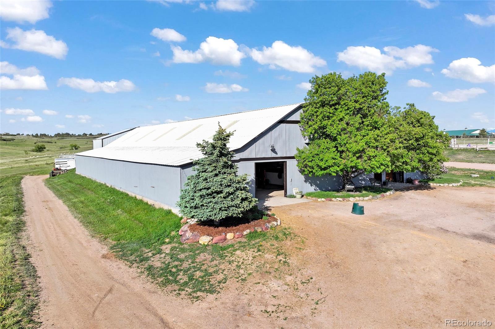 1705 Outter Marker Road Castle Rock, CO 80108 - Photo 9 of 40 a view of a backyard with plants and lake view