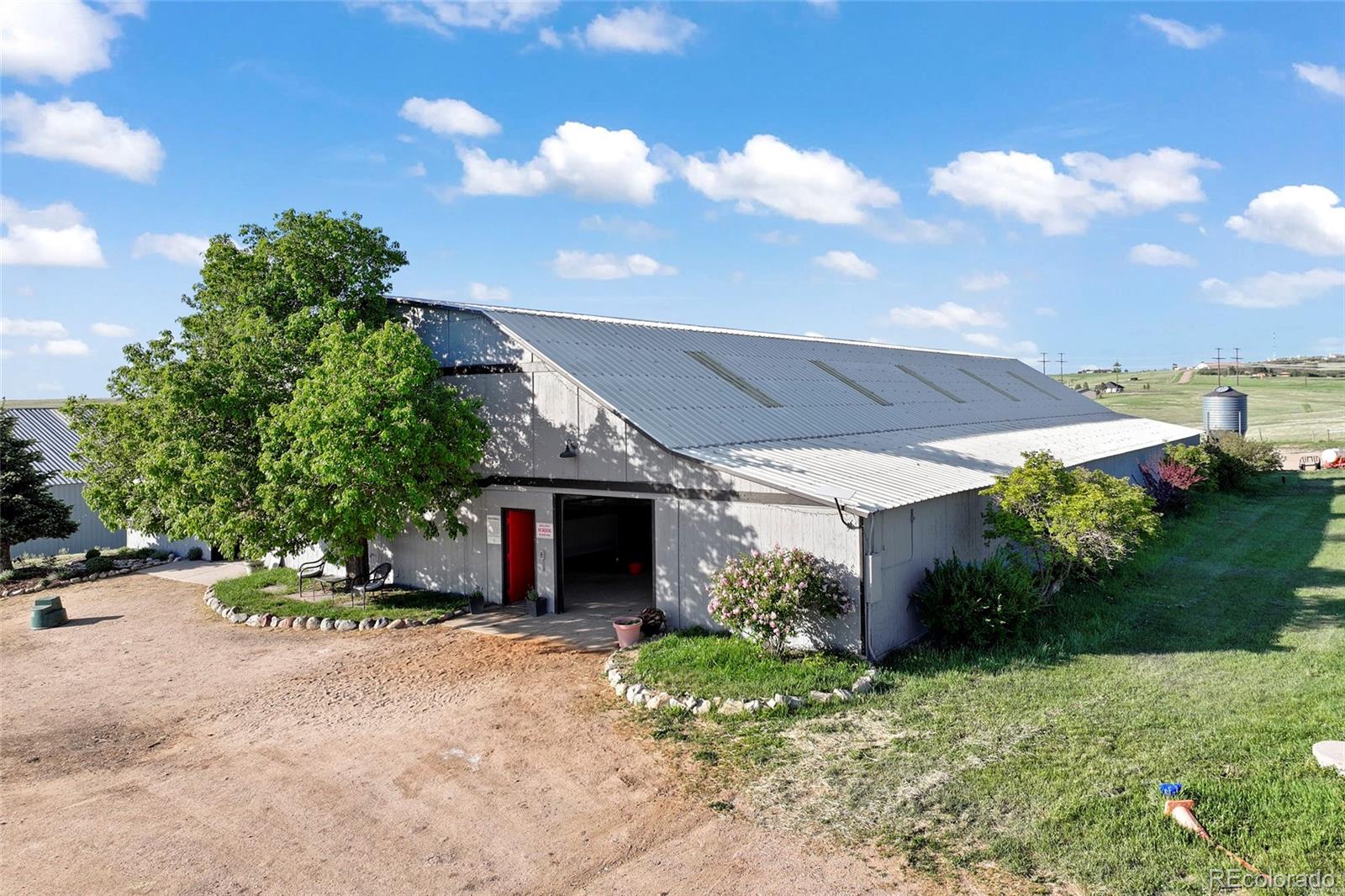 1705 Outter Marker Road Castle Rock, CO 80108 - Photo 10 of 40 a view of a chair and table in the garden