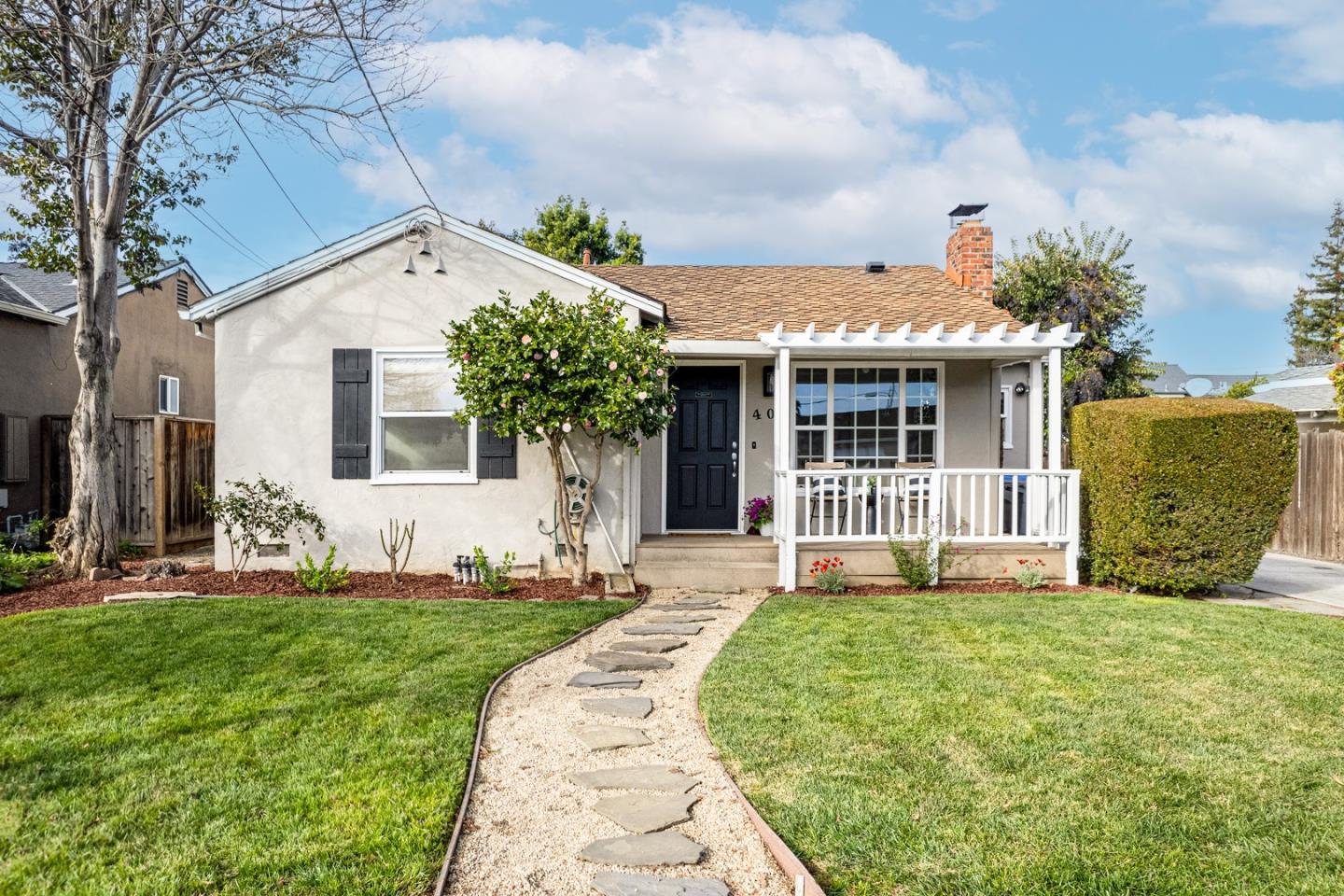 405 Flagg Avenue San Jose, CA 95128 - Photo 1 of 1 a front view of a house with garden