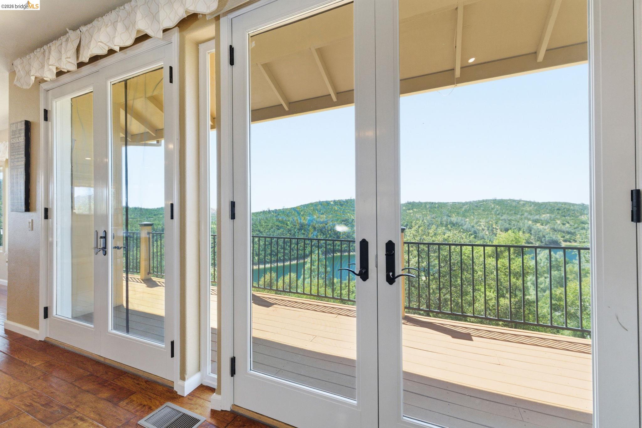 12808 Mammoth Mine Road Jamestown, CA 95327 - Photo 12 of 60 Doorway to outside featuring french doors, a wooded view, and hardwood / wood-style flooring