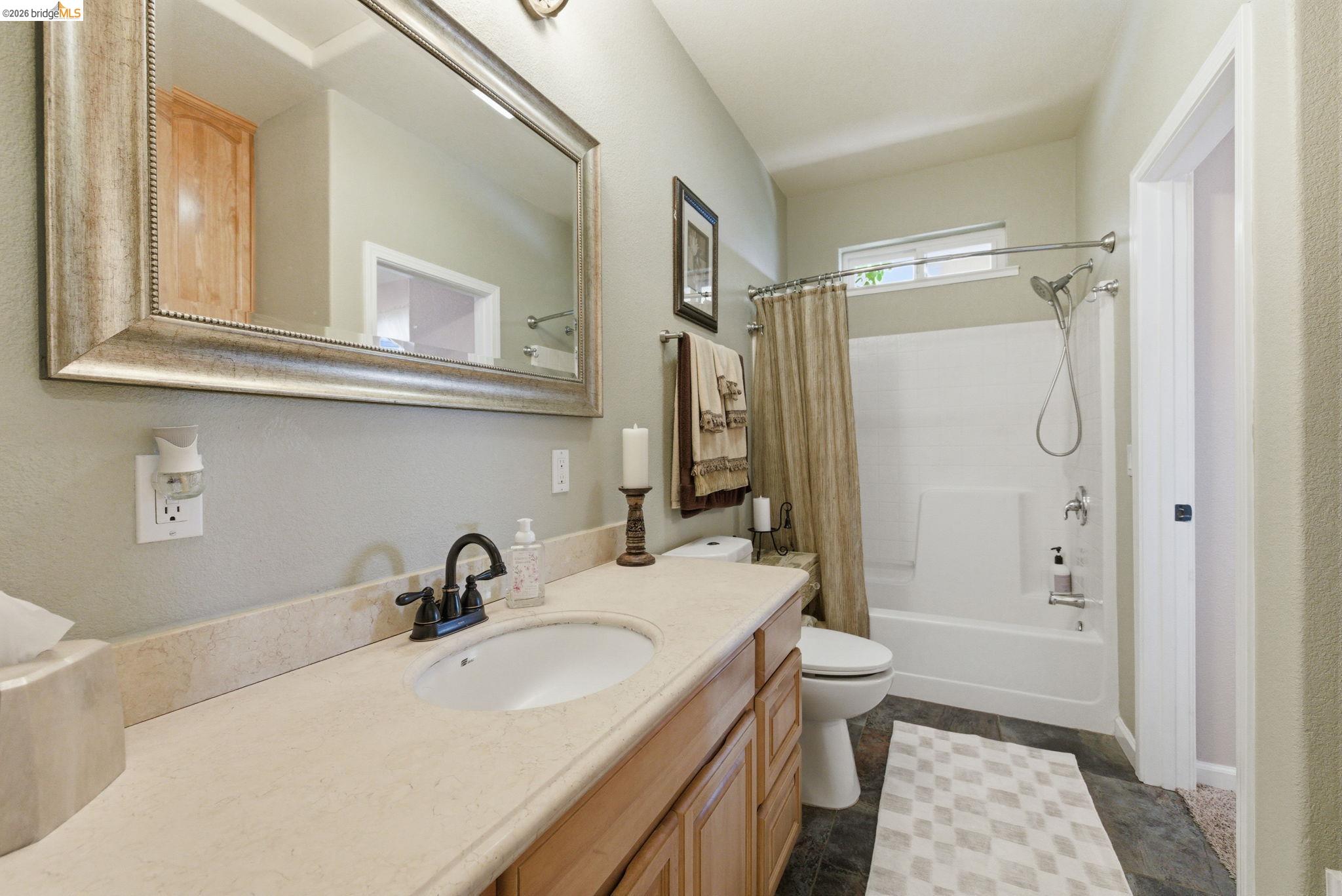 12808 Mammoth Mine Road Jamestown, CA 95327 - Photo 26 of 60 Full bathroom featuring vanity and shower / bathtub combination with curtain