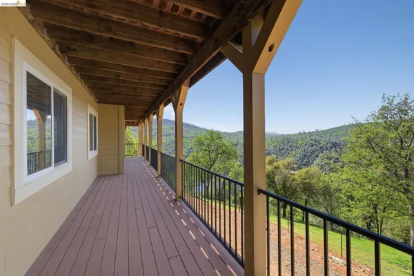 a view of a balcony with chairs