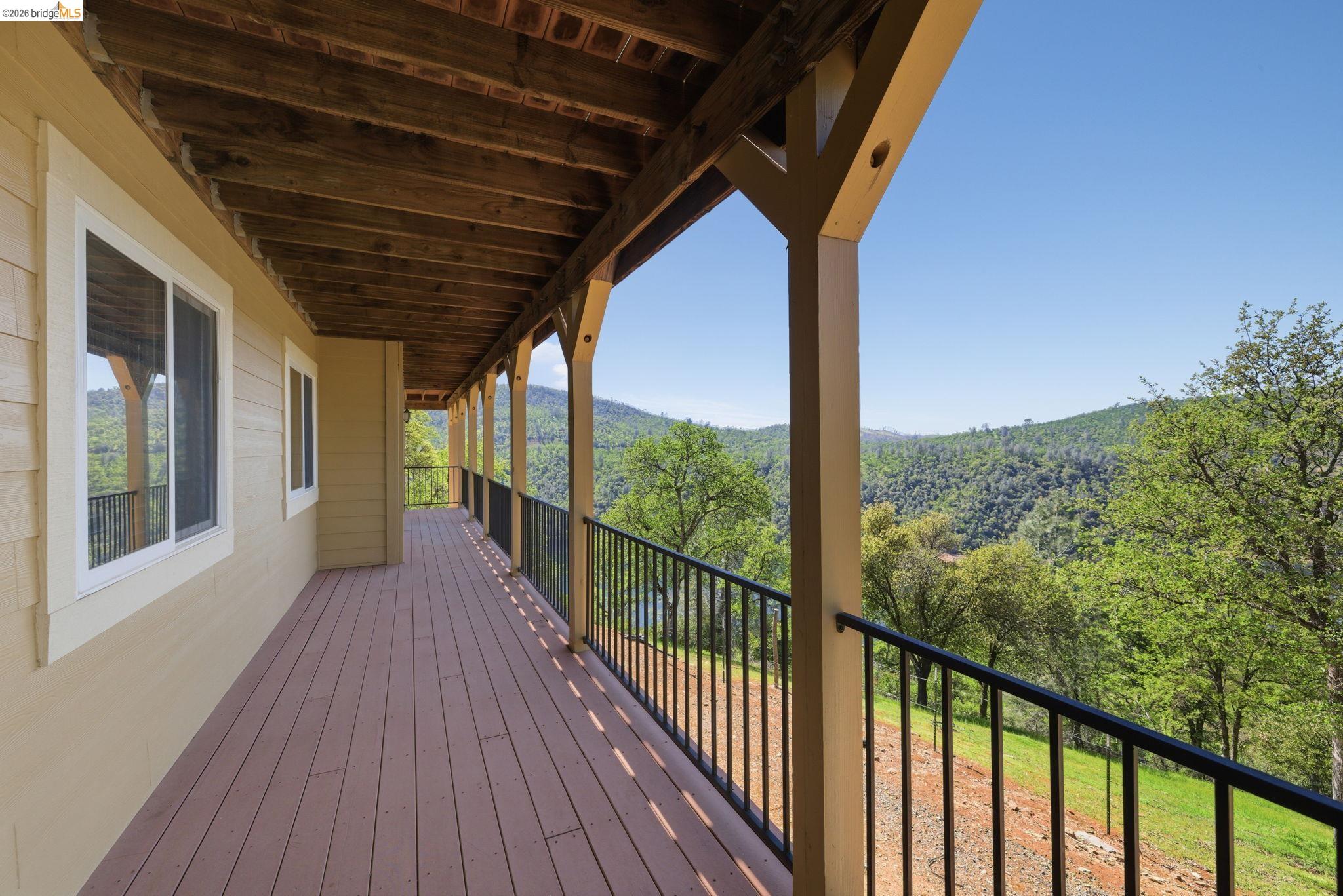 12808 Mammoth Mine Road Jamestown, CA 95327 - Photo 35 of 66 a view of a porch with wooden floor in front of house