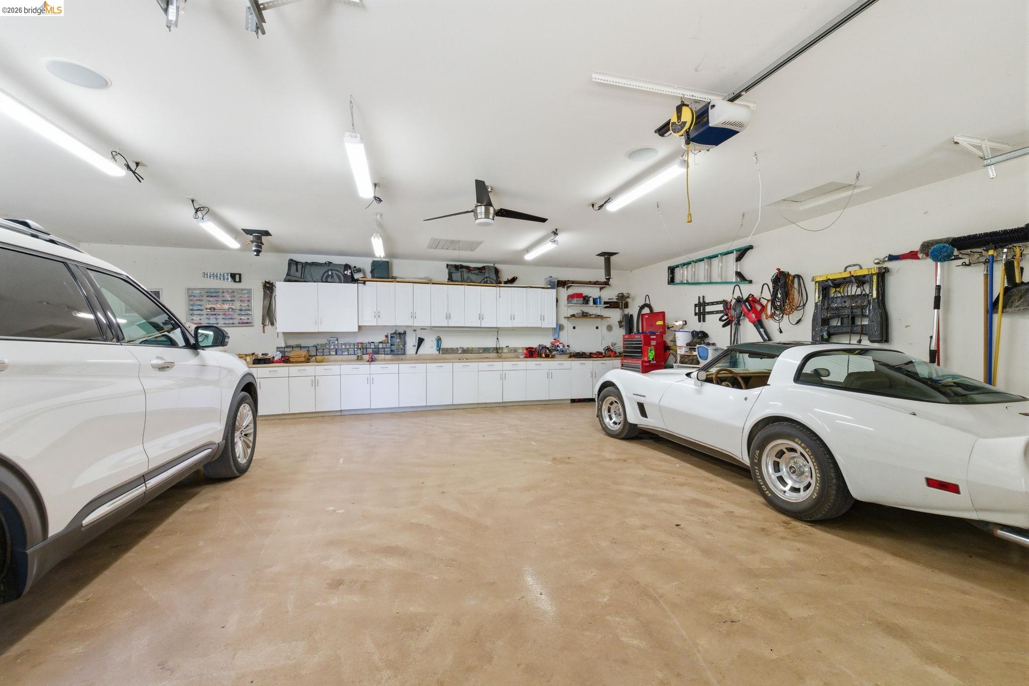 12808 Mammoth Mine Road Jamestown, CA 95327 - Photo 59 of 60 Garage featuring a workshop area and a garage door opener