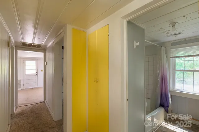 a view of bedroom with a bed and wooden floor