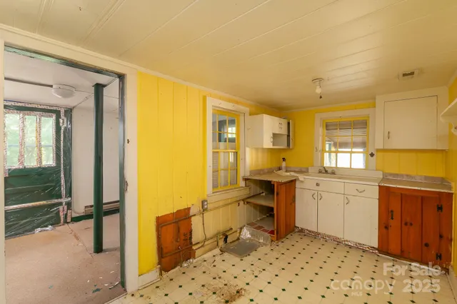 a large bathroom with a sink mirror and a bath tub