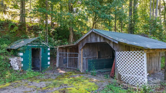 a view of a swimming pool and trees in the background