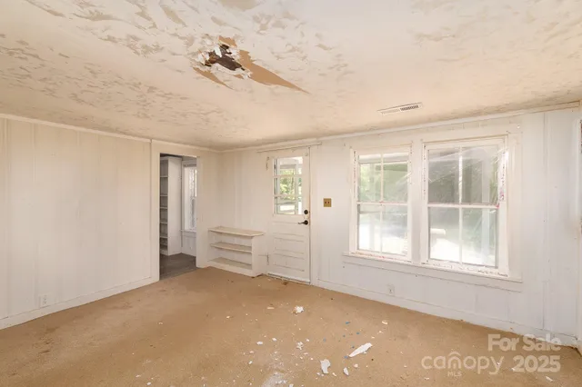 an empty room with windows