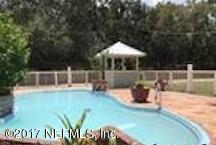 2055 Powell Road St. Augustine, FL 32084 - Photo 4 of 4 a view of a swimming pool with a bench