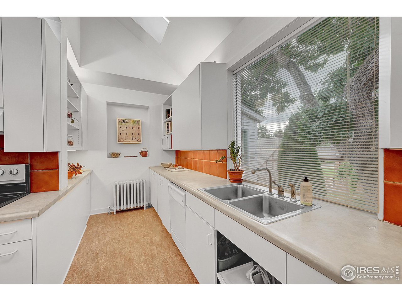 626 14th Street Boulder, CO 80302 - Photo 11 of 32 a kitchen that has a sink and a view of living room