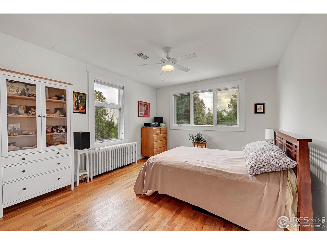 626 14th Street Boulder, CO 80302 - Photo 14 of 32 a bedroom with a bed and wooden floor