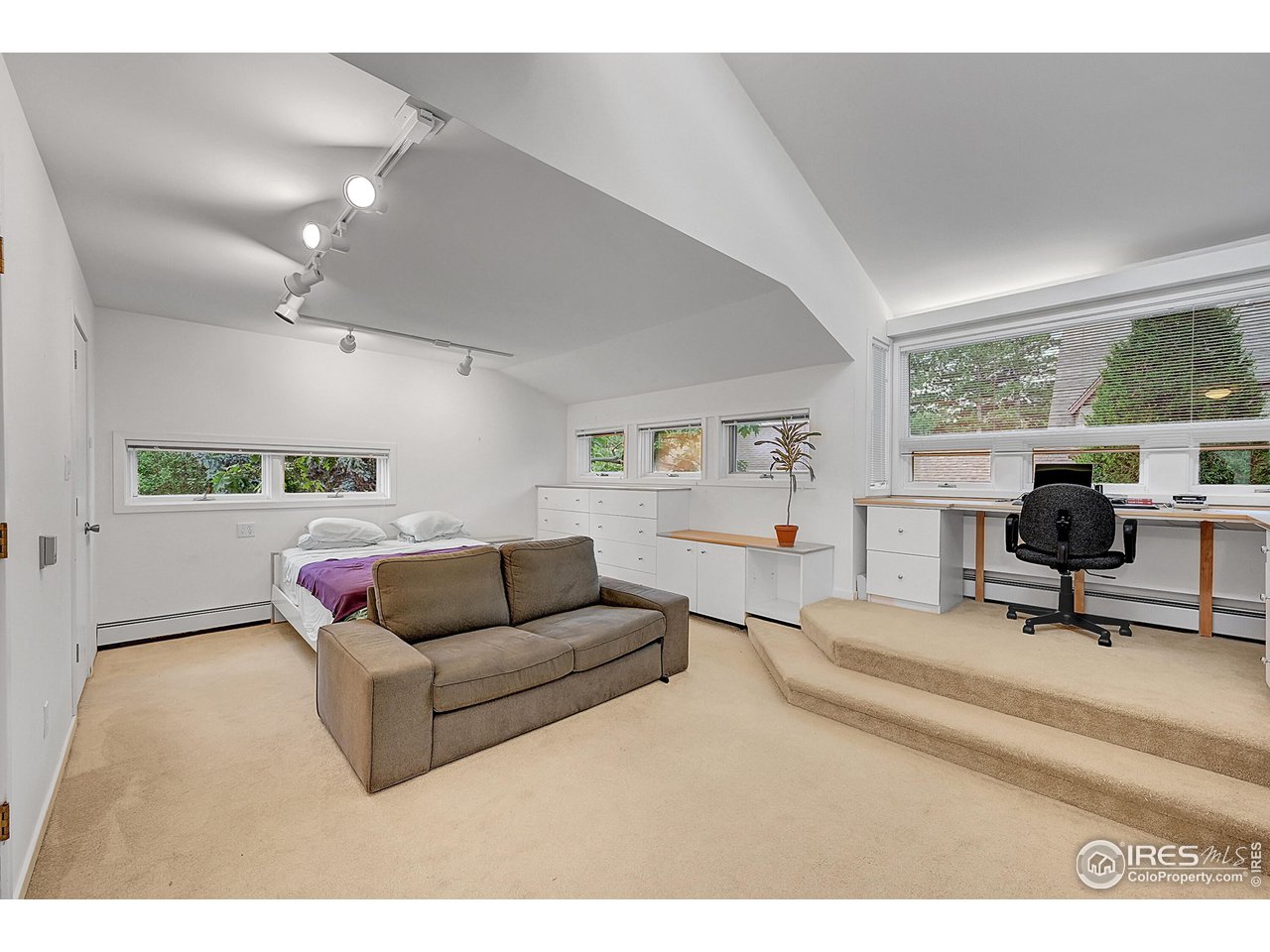 626 14th Street Boulder, CO 80302 - Photo 17 of 32 a living room with furniture and a table