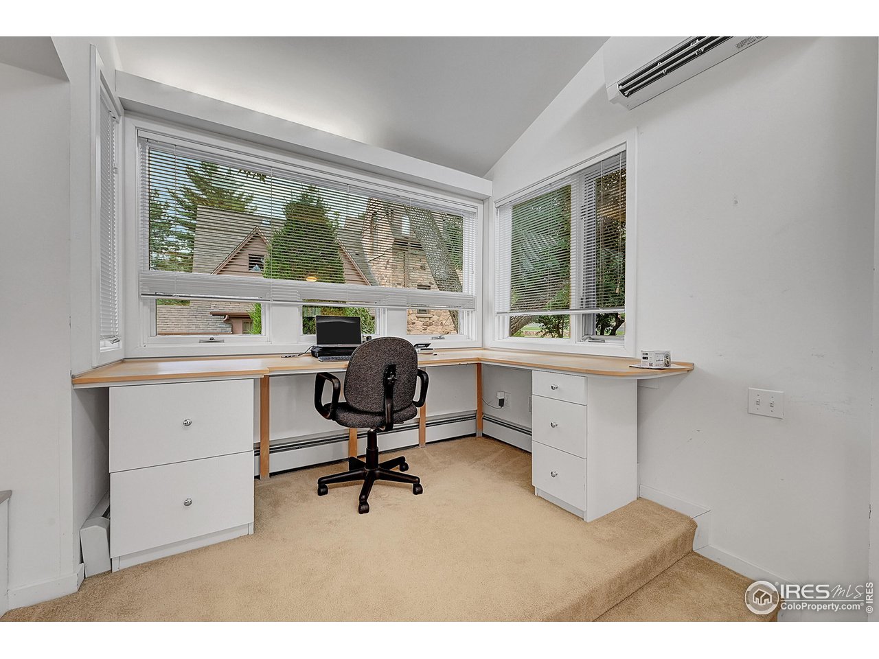 626 14th Street Boulder, CO 80302 - Photo 19 of 32 a view of a workspace with furniture and a window