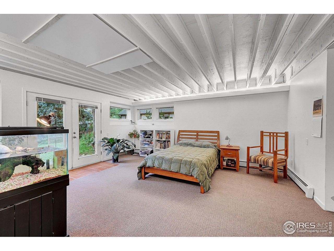626 14th Street Boulder, CO 80302 - Photo 24 of 32 a bedroom with furniture and a book shelf