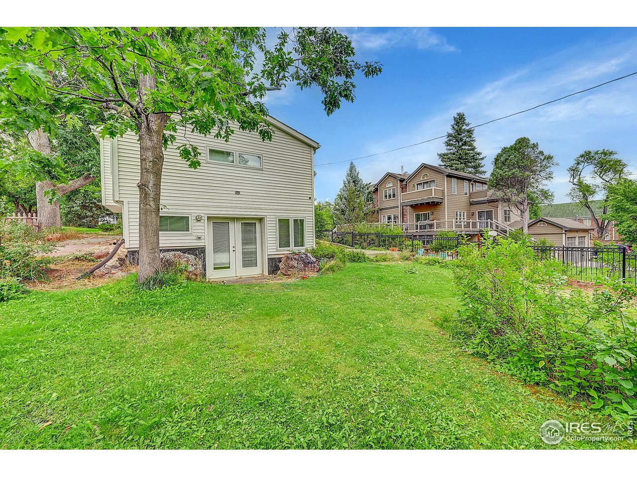 626 14th Street Boulder, CO 80302 - Photo 27 of 32 a view of a house with pool and garden