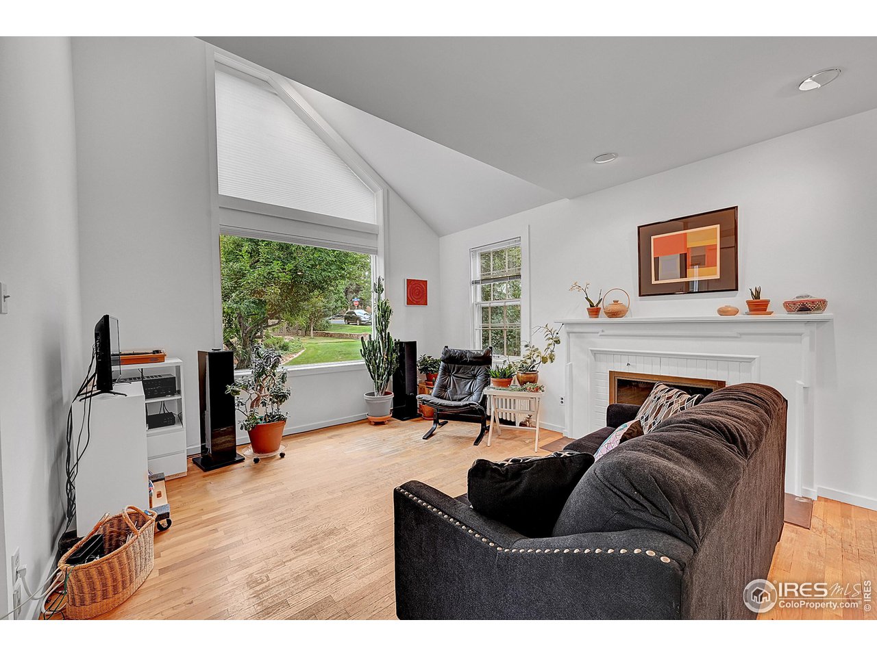 626 14th Street Boulder, CO 80302 - Photo 8 of 32 a living room with furniture and a fireplace