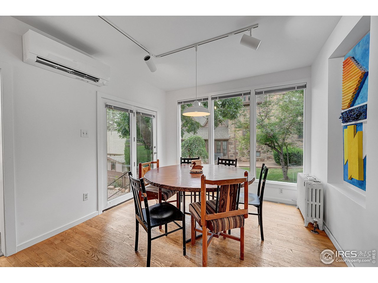 626 14th Street Boulder, CO 80302 - Photo 9 of 32 a dining room with furniture a chandelier and wooden floor