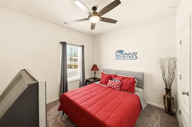 a bed room with a bed and a chandelier