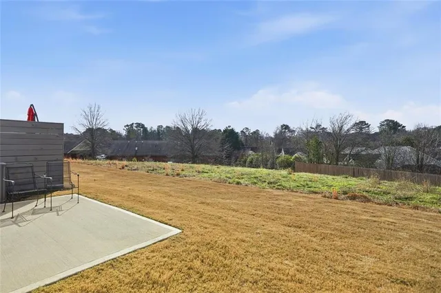 a view of a lake with a yard