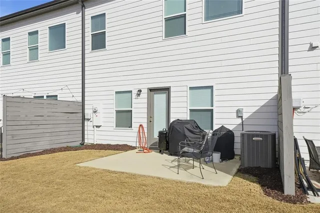a view of backyard with furniture and outdoor seating