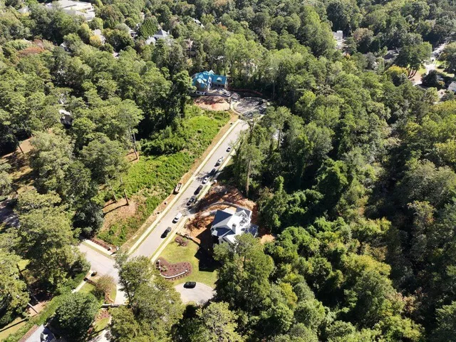 an aerial view of multiple house with a yard