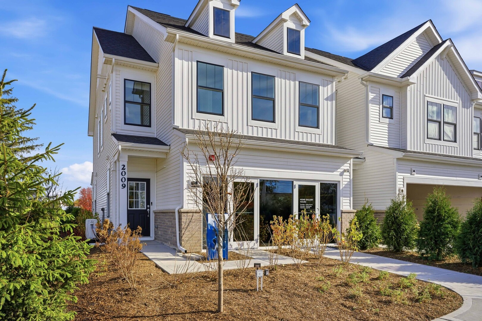 1979 Leiter Way, Unit 12004 Hoffman Estates, IL 60169 - Photo 2 of 24 a front view of a house with a tree in front