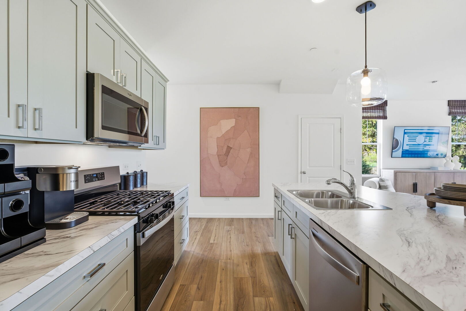 1979 Leiter Way, Unit 12004 Hoffman Estates, IL 60169 - Photo 5 of 24 a kitchen with stainless steel appliances granite countertop a sink a stove oven a counter space and cabinets