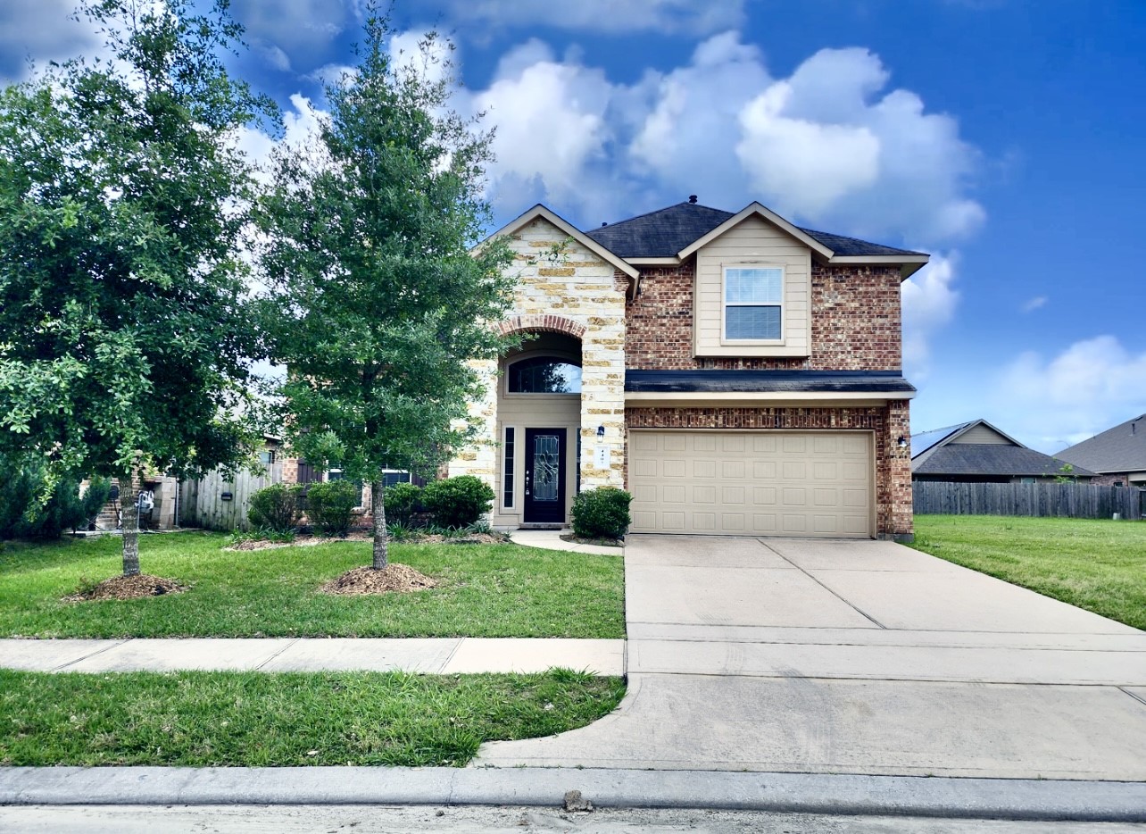 4407 Greenleaf Drive Spring, TX 77389 - Photo 1 of 29 a front view of a house with a yard and garage