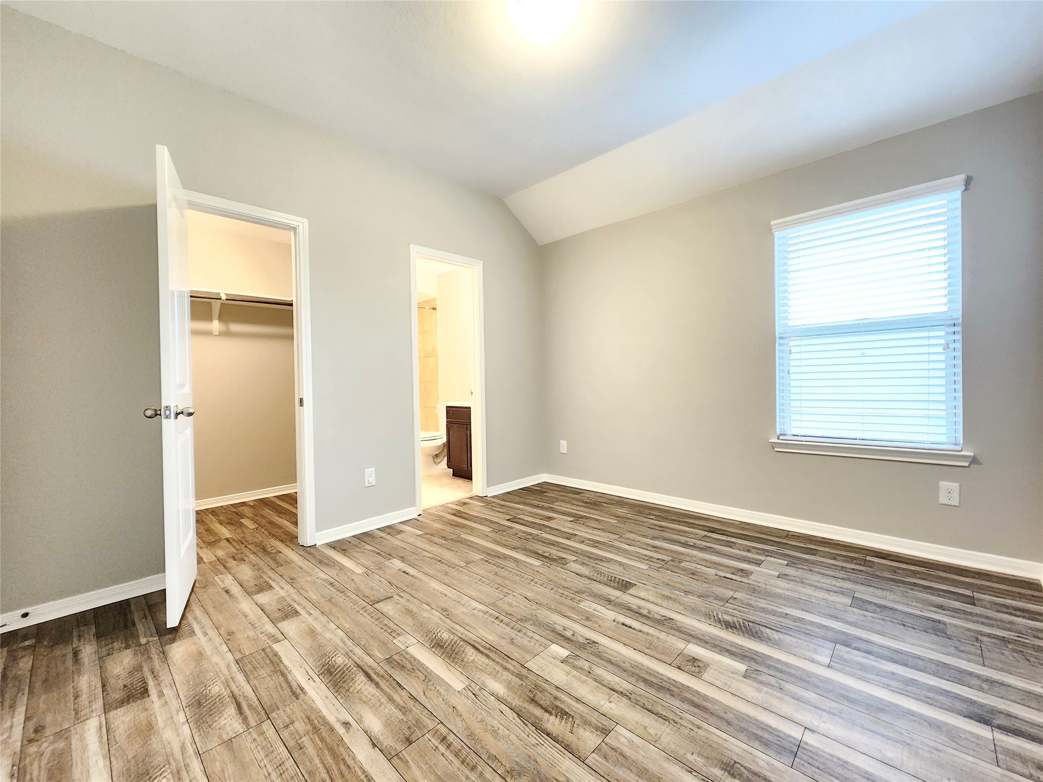 4407 Greenleaf Drive Spring, TX 77389 - Photo 20 of 29 a view of an empty room with wooden floor and a window