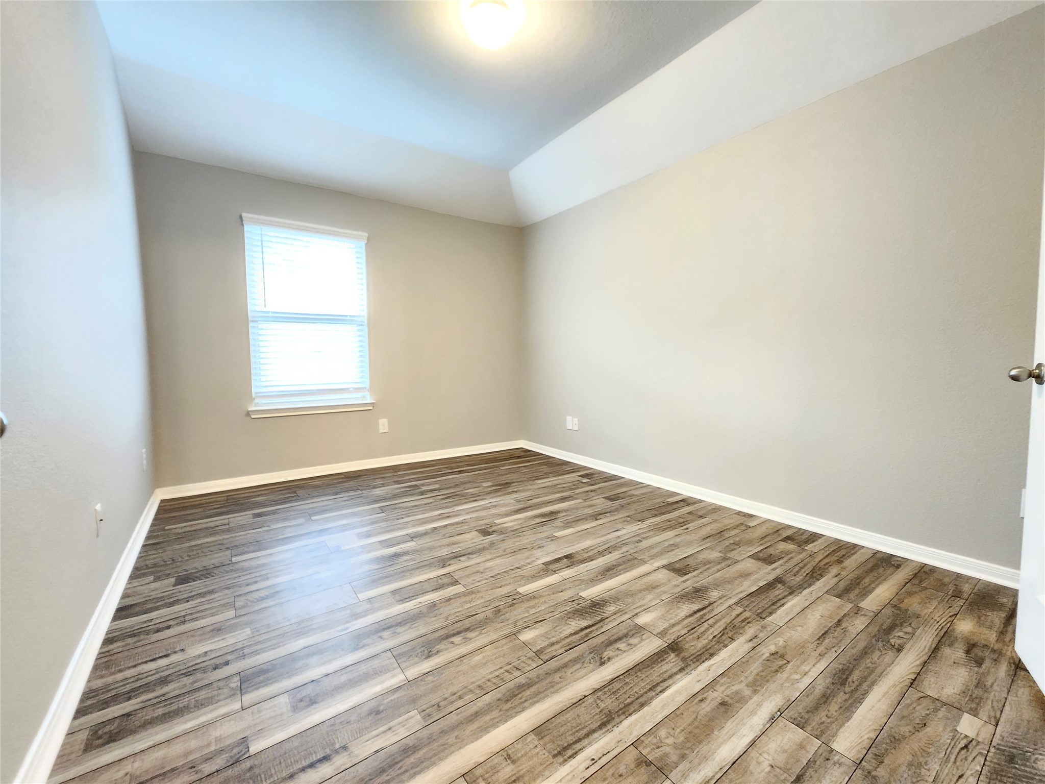 4407 Greenleaf Drive Spring, TX 77389 - Photo 24 of 29 an empty room with wooden floor and windows