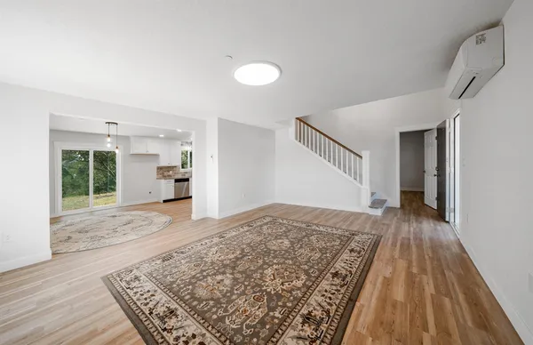 a kitchen with a sink a counter top space cabinets and a window