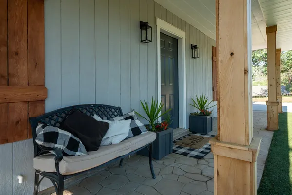 a view of front door and potted plants
