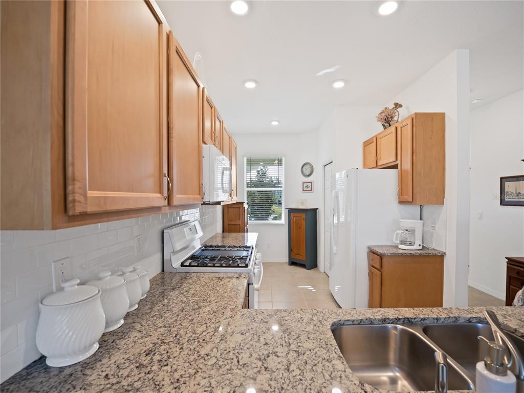7832 Southwest 86th Loop Ocala, FL 34476 - Photo 17 of 40 a kitchen with refrigerator and cabinets