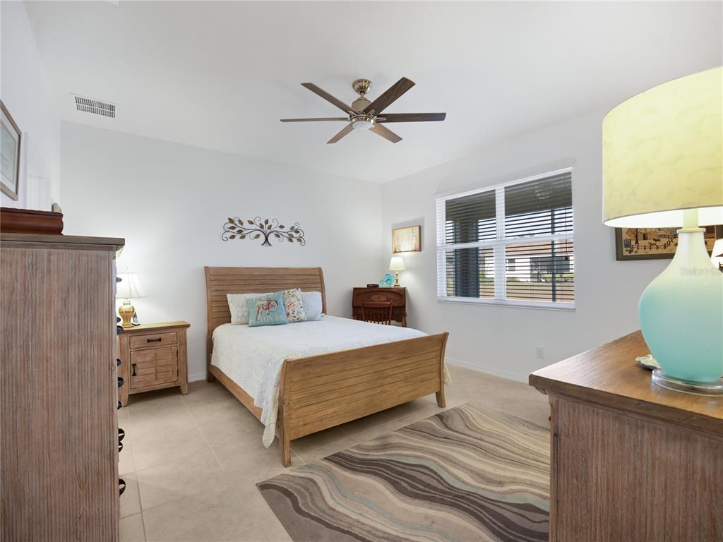 7832 Southwest 86th Loop Ocala, FL 34476 - Photo 25 of 40 a bedroom with a bed and window