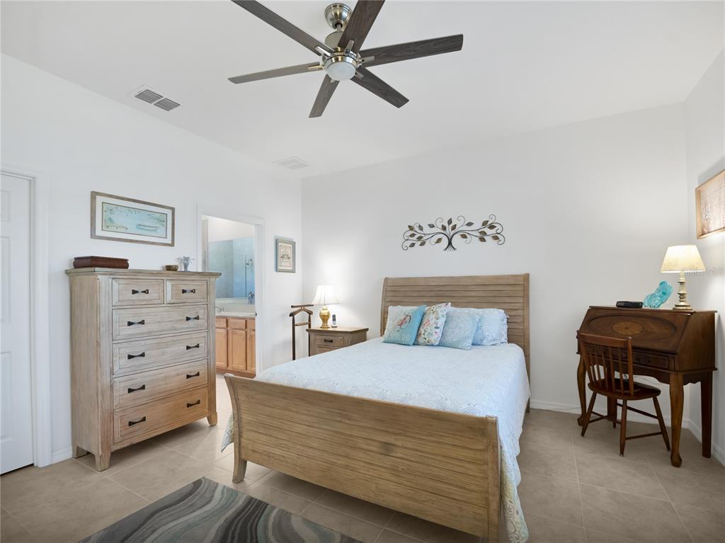 7832 Southwest 86th Loop Ocala, FL 34476 - Photo 26 of 40 a bedroom with a bed and a cabinets