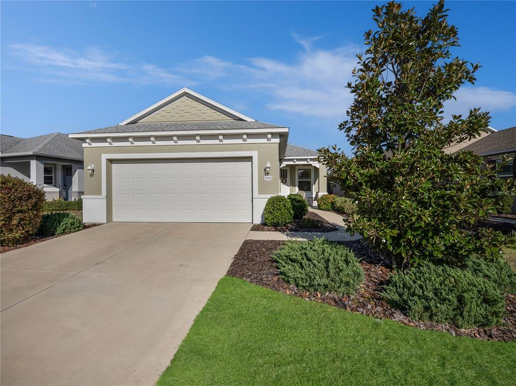 7832 Southwest 86th Loop Ocala, FL 34476 - Photo 35 of 40 a front view of a house with a yard