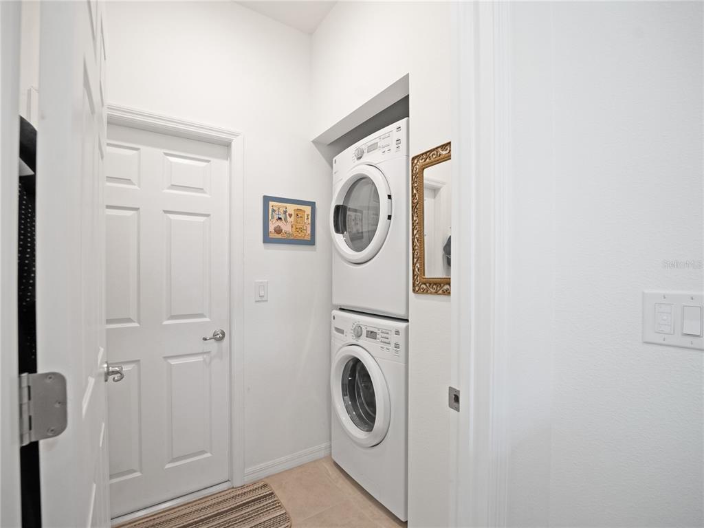 7832 Southwest 86th Loop Ocala, FL 34476 - Photo 6 of 40 a utility room with dryer and washer